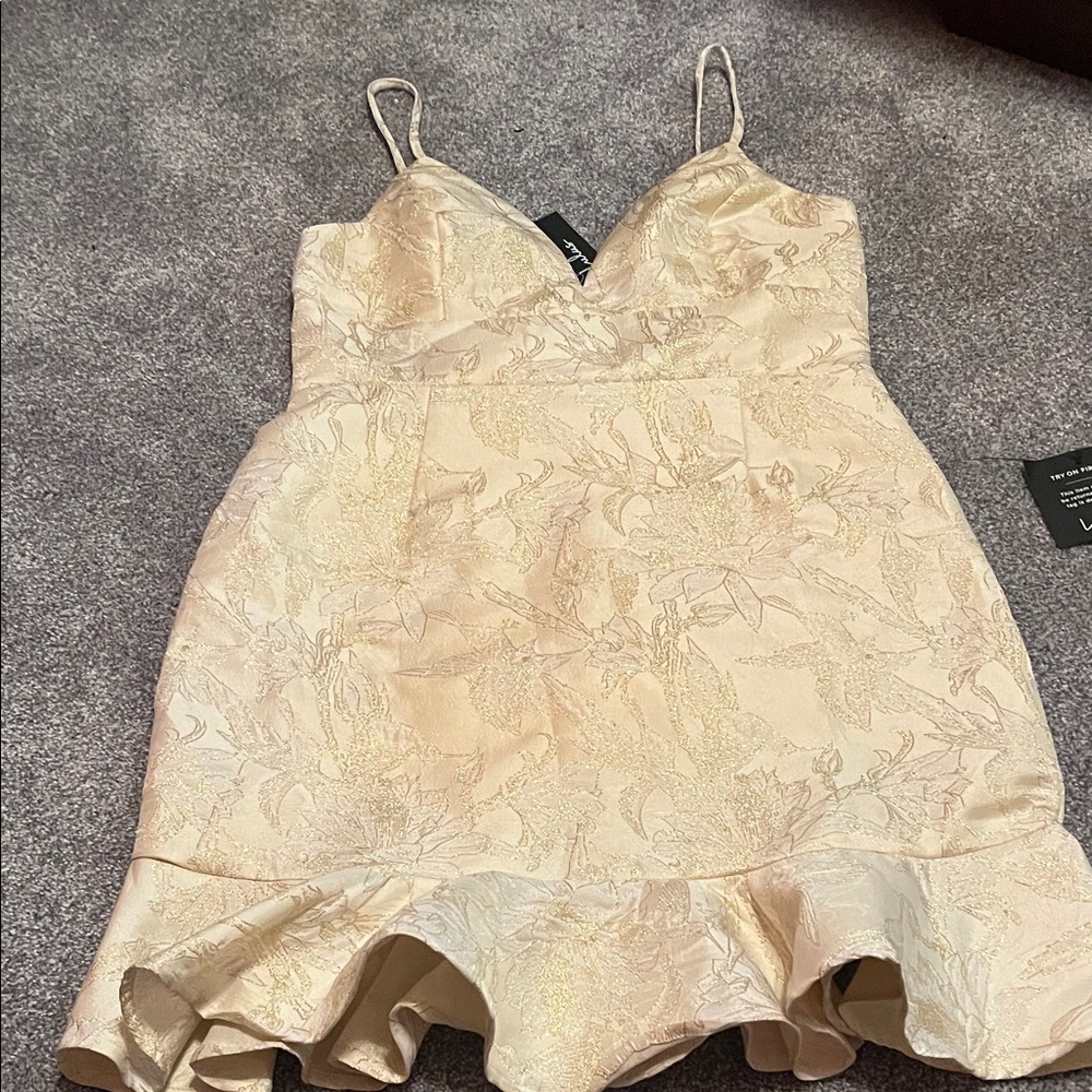 Cream and good fancy dress new cute ruffle on bottom.